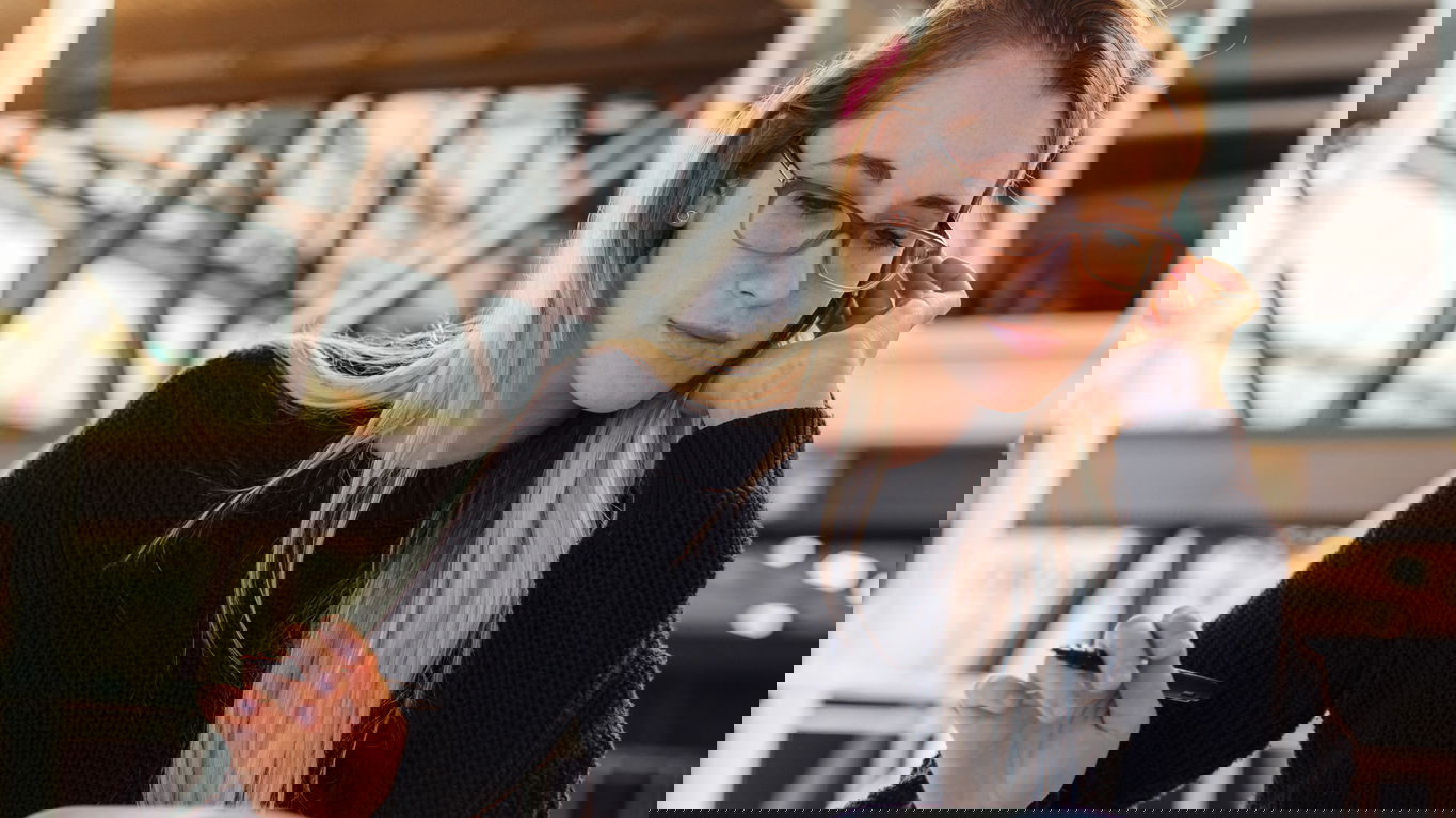 individualpromotion.jpg a young female doctoral candidate with books on a desk